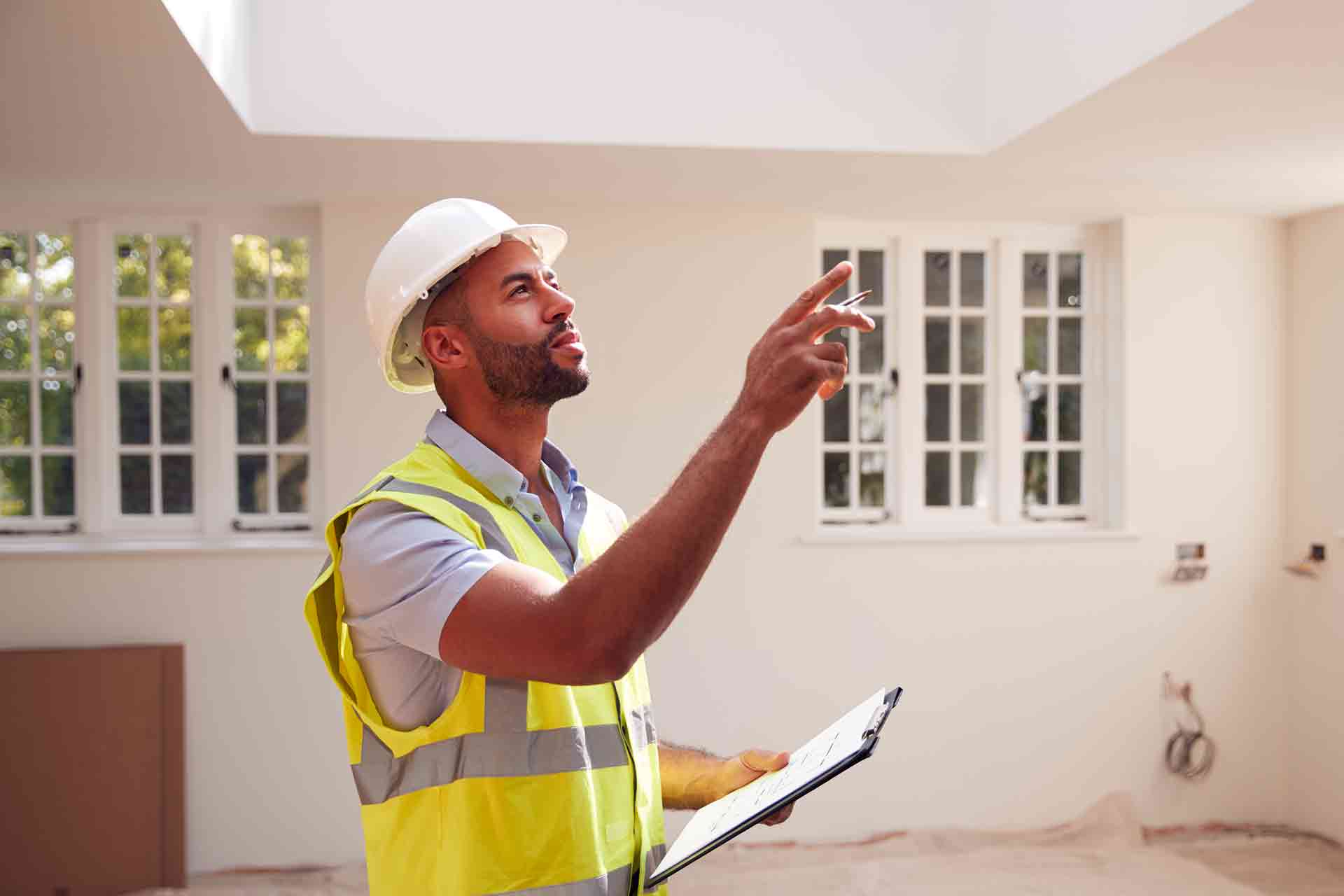 Third Party Wall Surveyors Telford reviewing plans between two parties during a dispute